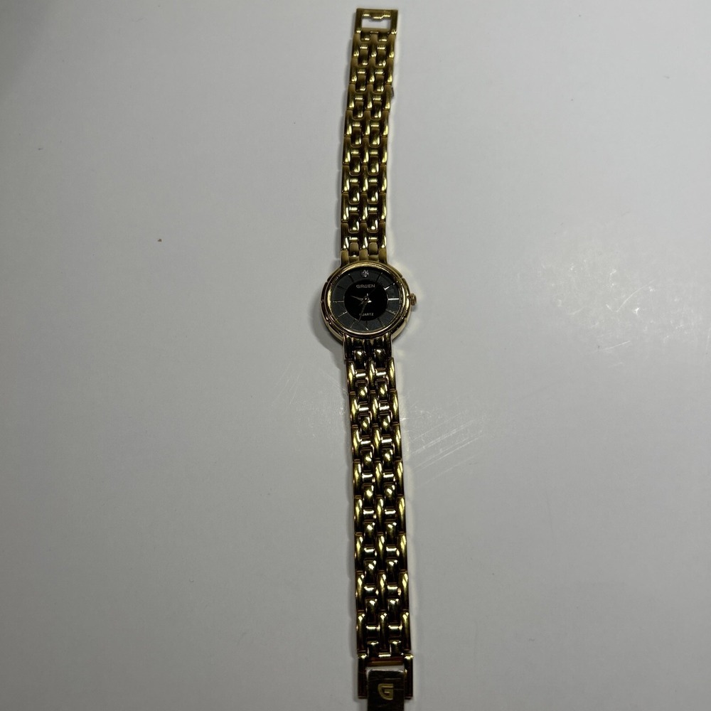 womens vtg 80s Gruden Gold Tone Watch Black Face Diamond Chip